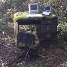 this is where post from [An etheral looking apple II in the woods resting a top an old computer desk].